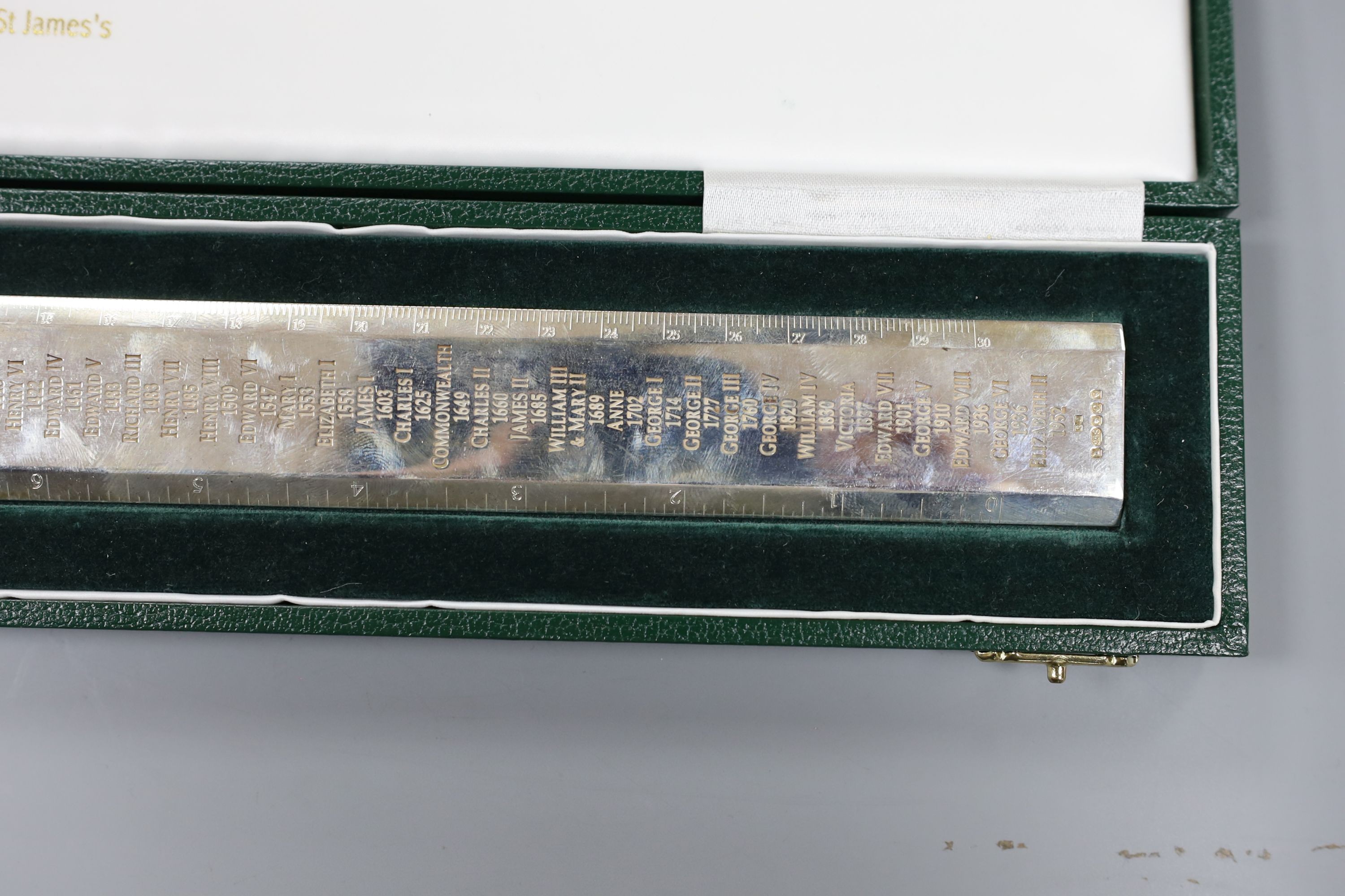 A cased modern Britannia standard silver 'Rule' ruler, engraved with the names and dates of the English Monarchy, by Richard O. A. Jarvis, London, 1977, 9.5oz.